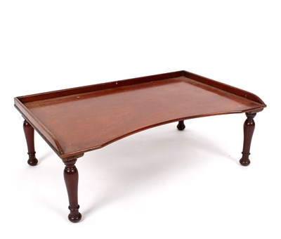 Lot 973 - A Victorian mahogany bed tray on turned...