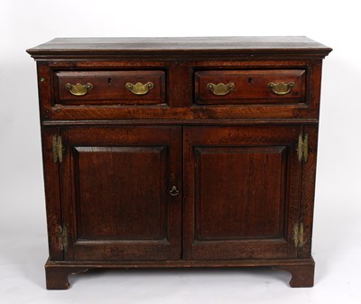 Lot 974 - A Georgian oak side cabinet, fitted two...