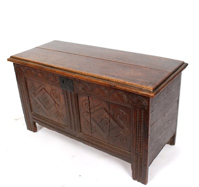 Lot 975 - An 18th Century oak coffer with hinged cover...