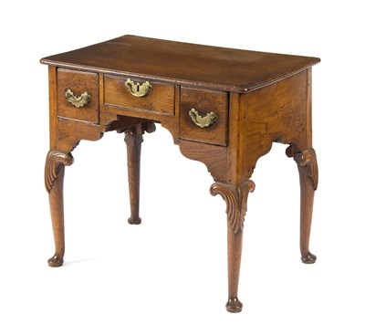 Lot 986 - A George III oak lowboy fitted three drawers,...