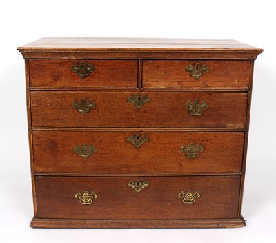 Lot 990 - A George III oak chest of two short over three...