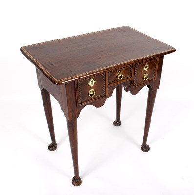 Lot 994 - An early 18th Century oak and inlaid lowboy,...