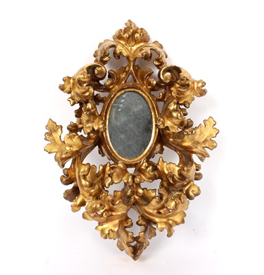 Lot 997 - A Florentine gilt framed mirror, the oval...