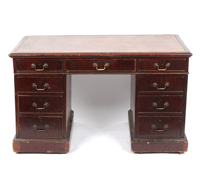 Lot 1001 - A mahogany veneered kneehole desk fitted a...