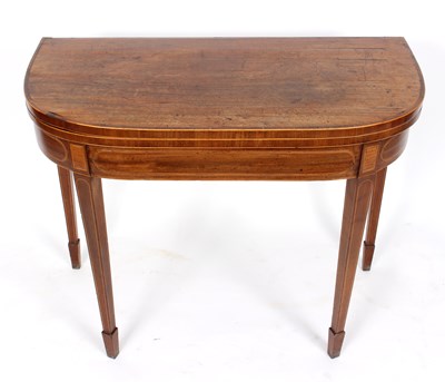 Lot 1010 - A George III mahogany fold-over card table,...