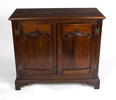 Lot 1013 - A pine two-drawer cupboard, enclosed by a pair...