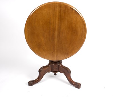 Lot 1017 - A circular mahogany table, on a turned column...