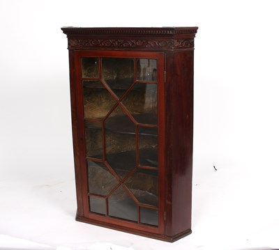 Lot 1023 - A 19th Century mahogany corner cupboard,...