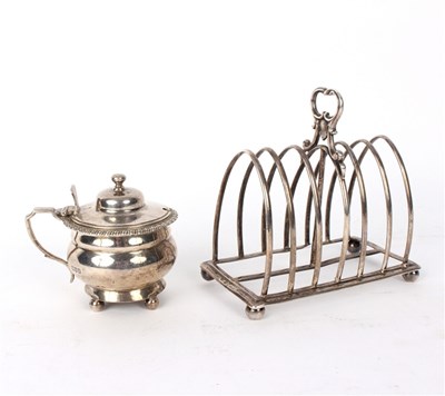 Lot 65 - A Victorian silver toast rack, London 1874,...