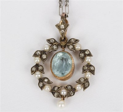 Lot 93 - An Edwardian aquamarine pendant in a diamond...