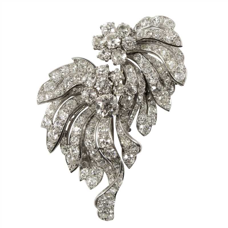 Lot 139 - A diamond double clip brooch of floral form,...