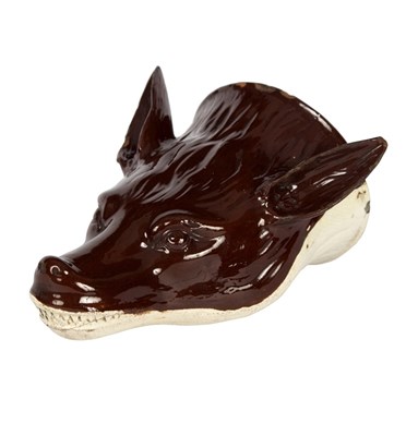 Lot 350 - A brown glazed creamware fox mask stirrup cup,...
