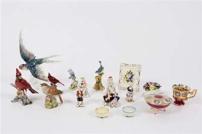 Lot 383 - A collection of miniature porcelain figures,...