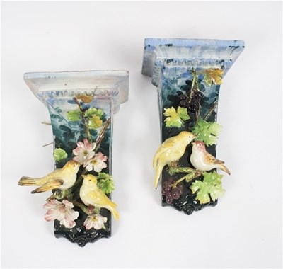Lot 389 - A pair of wall brackets with birds in relief,...