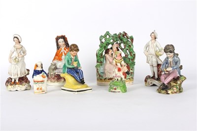 Lot 407 - A group of Staffordshire figures, including a...