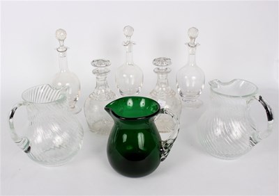 Lot 419 - A group of glass decanters and jugs comprising...