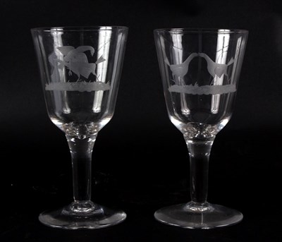 Lot 425 - A pair of glass goblets engraved with cock...
