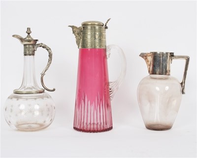 Lot 432 - A ruby tinted glass claret jug with plated...