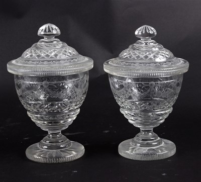Lot 434 - A pair of cut and engraved glass jars, second...
