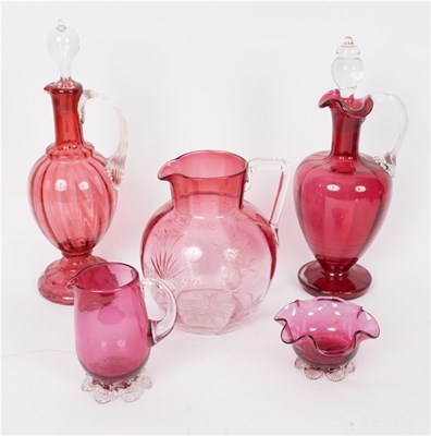 Lot 439 - Two cranberry glass decanters and stoppers...