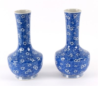 Lot 445 - A pair of Japanese blue and white bottle vases,...