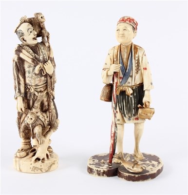 Lot 457 - Two Meiji period carved ivory figures, one of...
