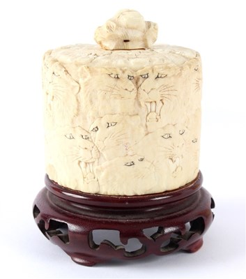 Lot 459 - A Japanese cylindrical ivory box and cover...