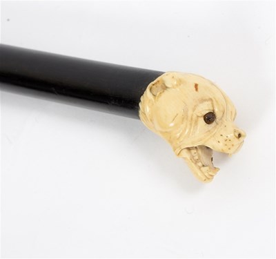 Lot 475 - An ebonised walking stick, the carved ivory...