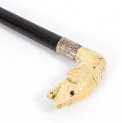 Lot 476 - An ebonised walking stick, the carved ivory...