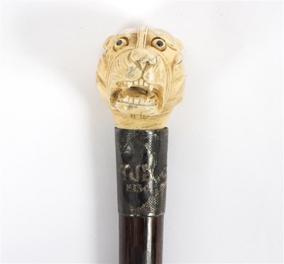 Lot 479 - An ebonised walking stick the mount initialled...