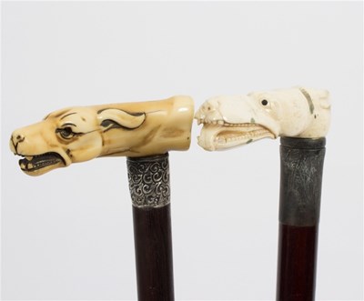 Lot 482 - A walking stick, the carved ivory handle in...