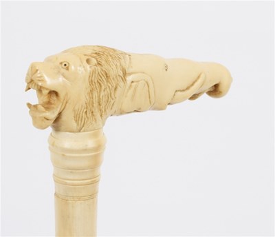 Lot 490 - An ivory walking stick, the carved ivory...