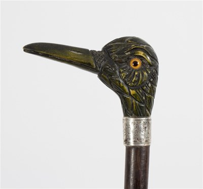 Lot 497 - A malacca walking stick with carved stained...