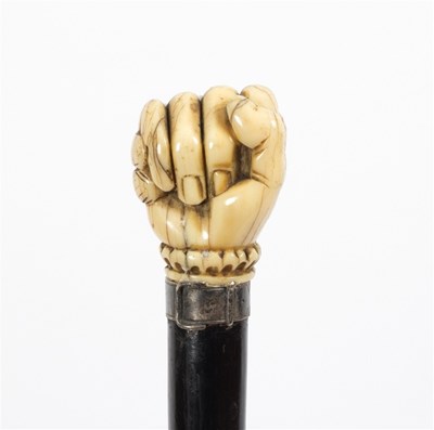 Lot 502 - An ebonised walking stick, the carved ivory...