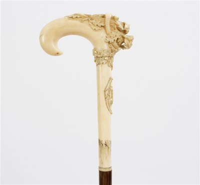 Lot 508 - A bamboo walking stick, the ivory handle in...