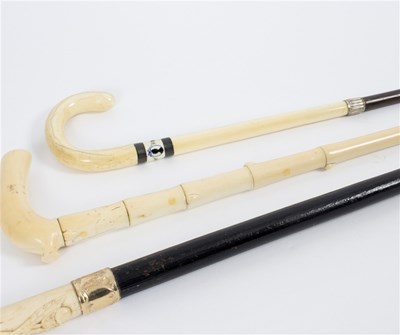 Lot 510 - An ebonised walking stick, the carved ivory...