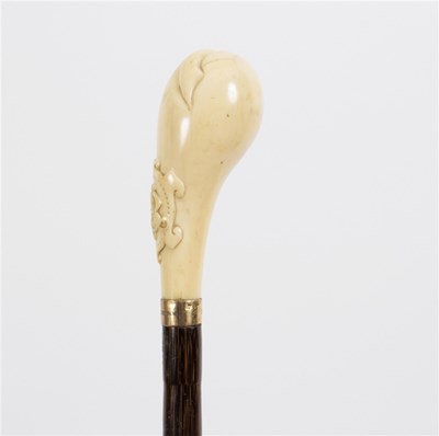 Lot 512 - A malacca walking stick, the carved ivory...
