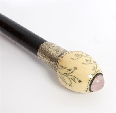 Lot 515 - An ebonised walking stick, the ivory ovoid...