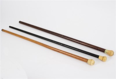 Lot 520 - Three walking sticks, all with similar ivory...