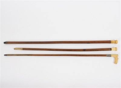 Lot 522 - A walking stick, the bone handle with engraved...