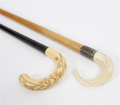 Lot 531 - Four walking sticks, with ivory handles, two...