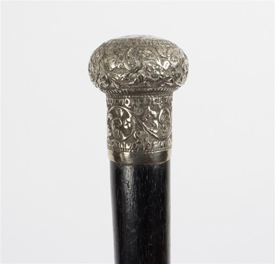 Lot 534 - An ebonised walking stick with Eastern white...