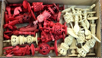 Lot 555 - Various natural and red stained ivory chess...