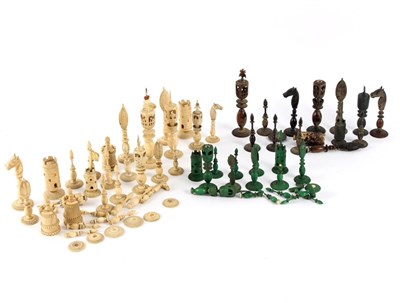Lot 556 - A quantity of carved ivory chess pieces to...