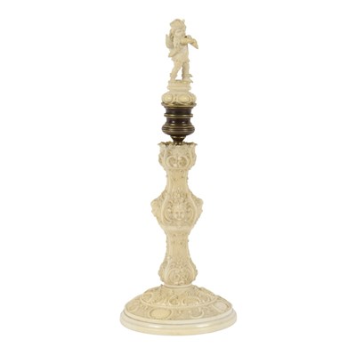 Lot 831 - A fine 18th Century carved ivory candlestick...
