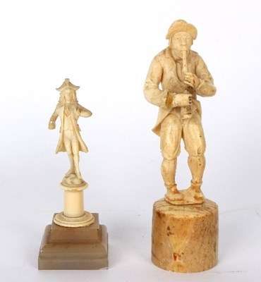 Lot 832 - A 19th Century carved ivory figure of a...