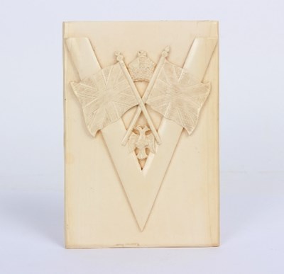 Lot 836 - A carved ivory relief, emblem of Victory with...