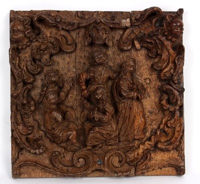 Lot 838 - A carved oak panel with central figures within...