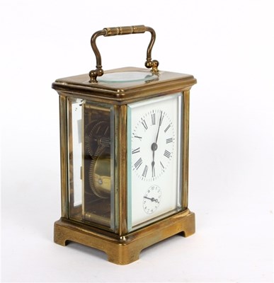 Lot 850 - A gilt brass cased carriage clock, the white...