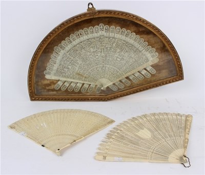 Lot 862 - A carved ivory brise fan with pierced stylised...